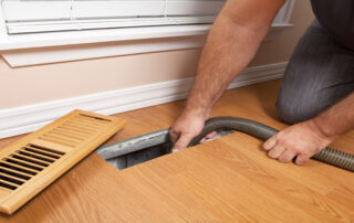This image shows an air duct being cleaned.