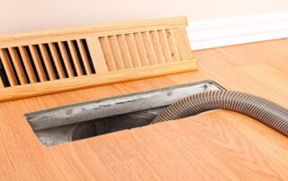 This image shows an airduct being cleaned.